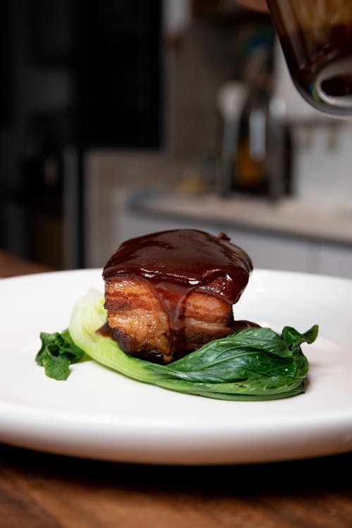 Cooked Food with Green Vegetable on White Ceramic Plate