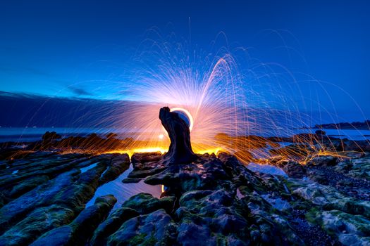 Time Lapse Photography of Water Splash on Rocks during Night Time