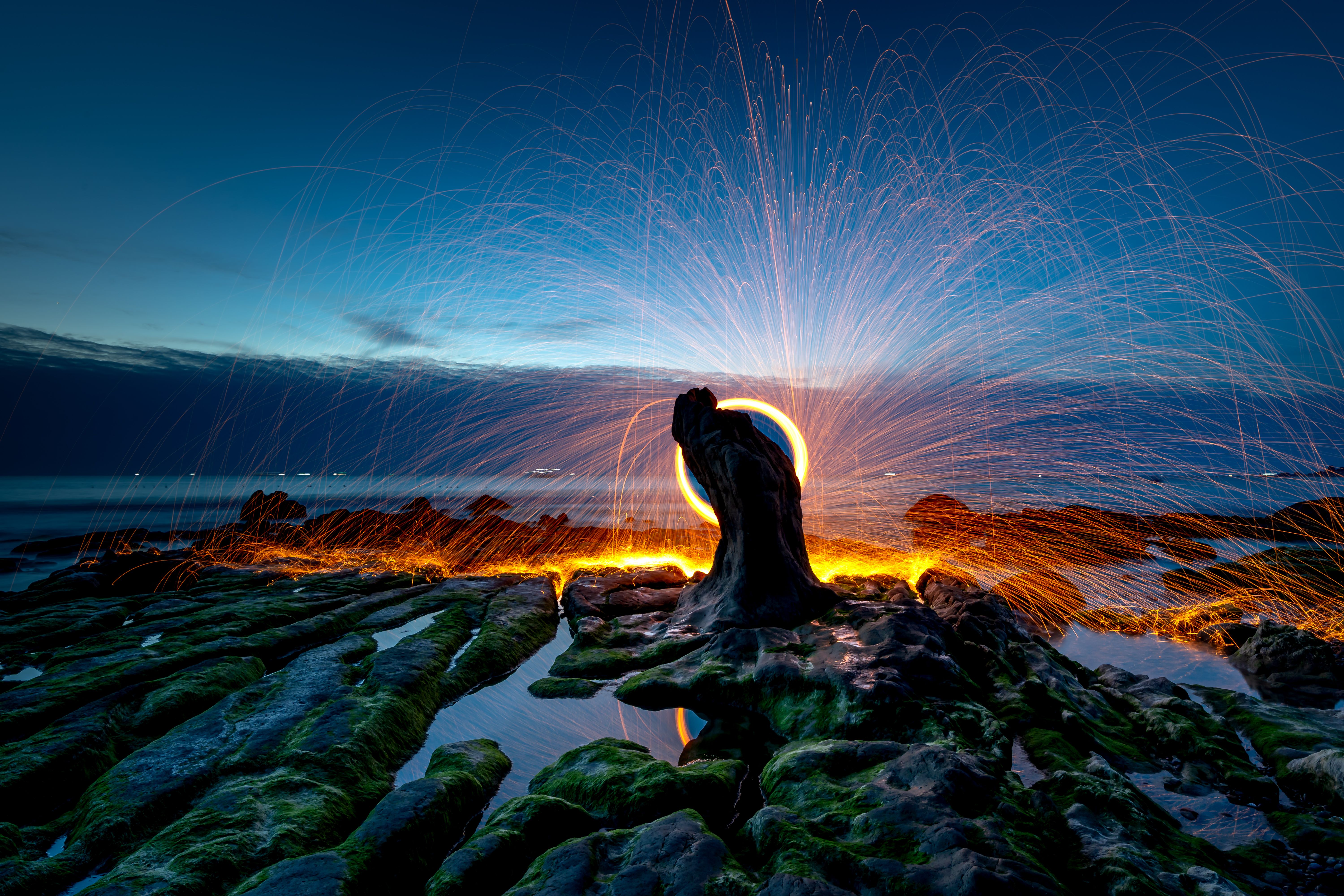 surreal rocky landscape under dramatic night sky