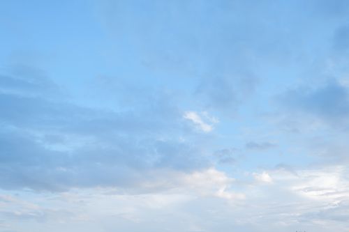 Free A tranquil sky filled with soft, scattered clouds on a clear summer day. Stock Photo