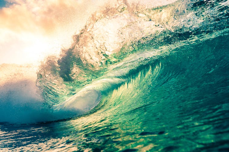 Scenic Turquoise Sea Wave Under Bright Sunny Sky