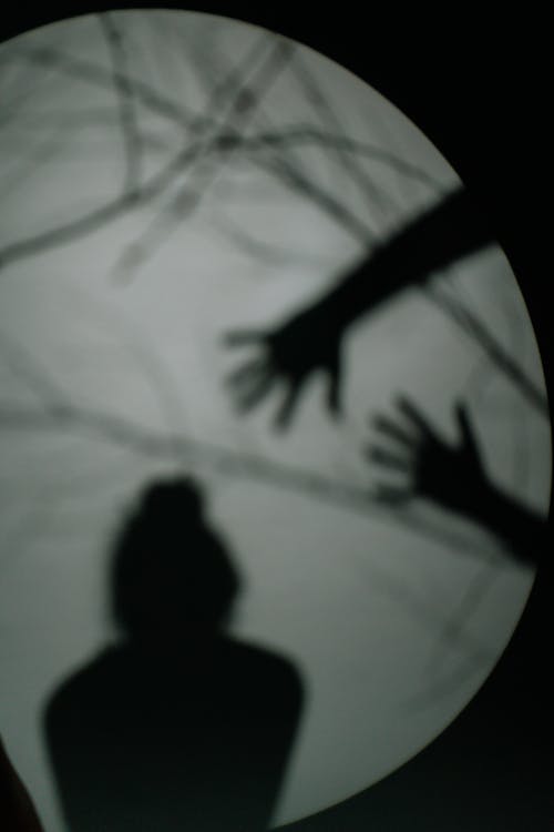 Free Shadow of a Person and Hands on Glass Stock Photo