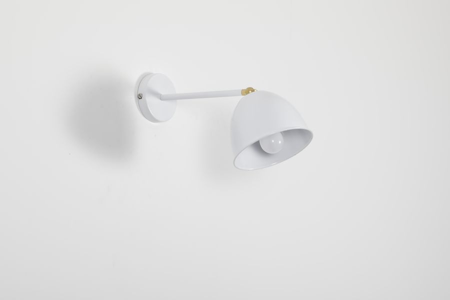 White wall lamp in a minimalist interior — photo by Prem Singh Tanwar on Pexels