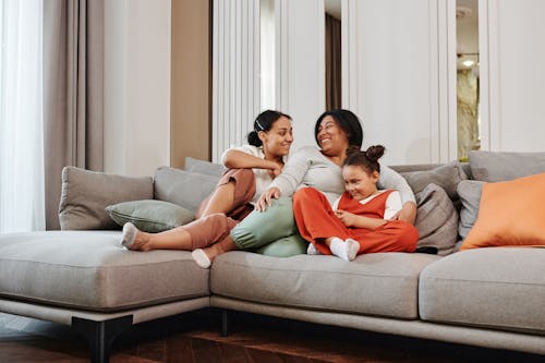 Women and a Young Girl Sitting on the Sofa