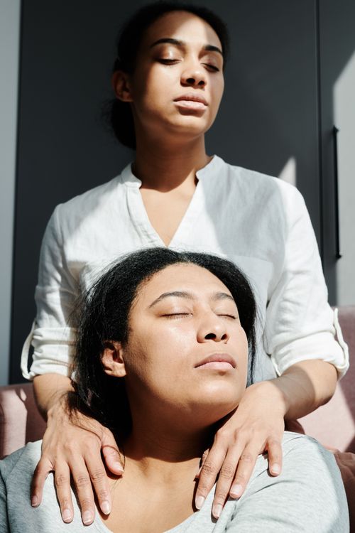 Free Close-up of a loving couple with eyes closed, embracing gently indoors. Stock Photo