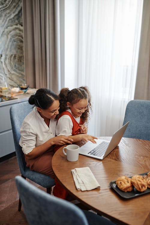 Free Mother and Daughter Using a Laptop Stock Photo