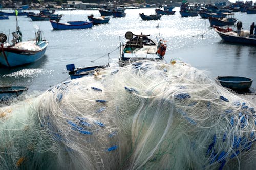 Free Fishing Net Near the Boats Stock Photo