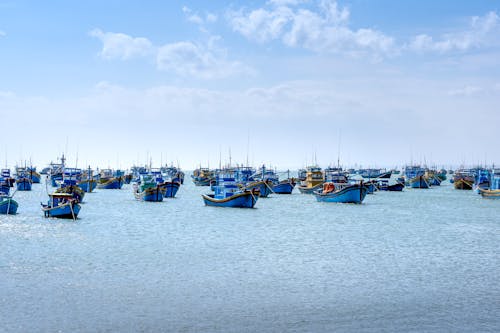 Boats Sailing on the Sea Under the Clear Blue Sky 