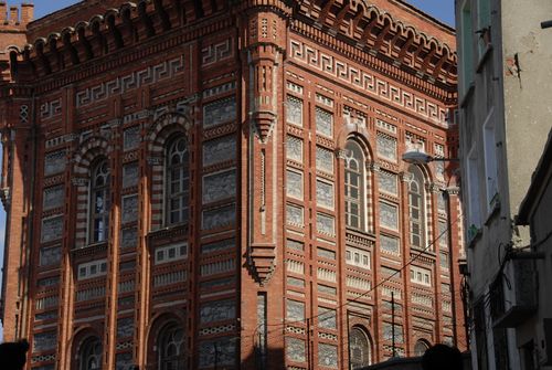 Free Detailed view of a historic brick building with arched windows in Istanbul. Stock Photo