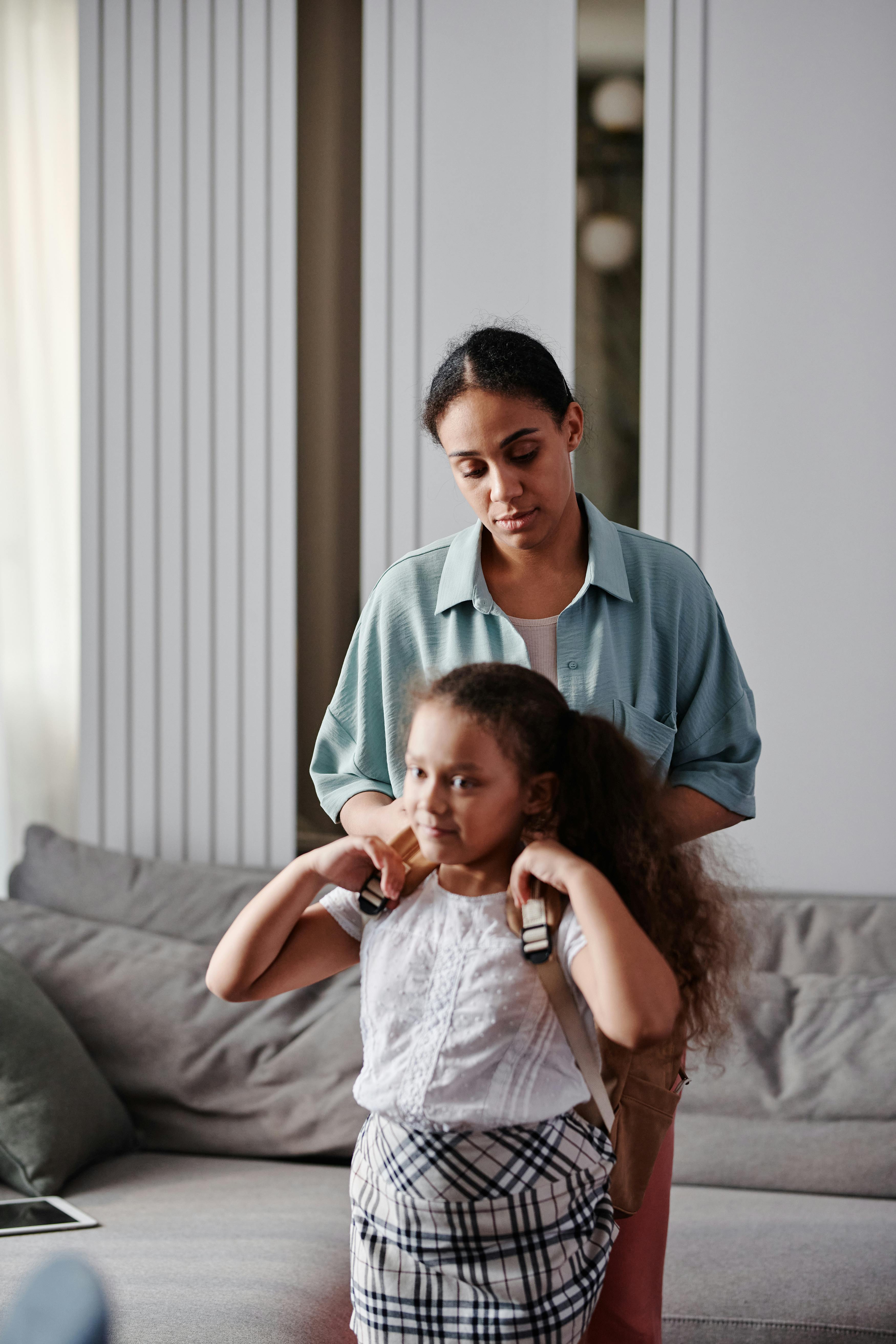 mother and child standing at the living room