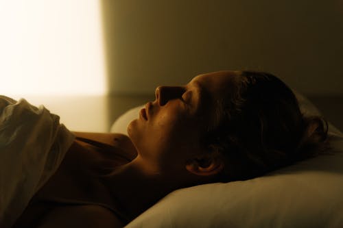 Free Photo of a Woman Sleeping on the Bed Stock Photo