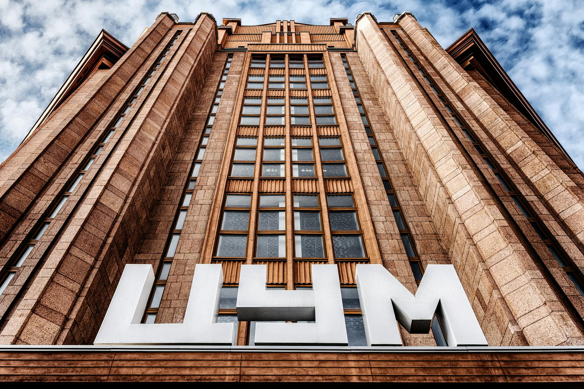 Low angle shot of the TSUM department store facade in Kyiv showcasing its architectural design.