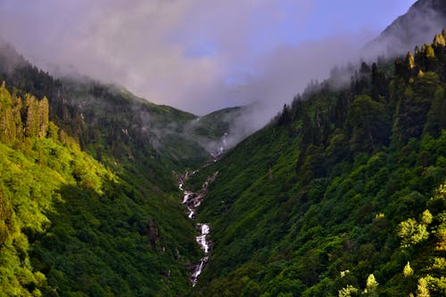 Aerial Photography of Cloudy Green Mountains 