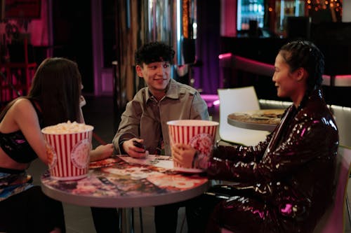 Friends with Popcorn in Cinema Bar