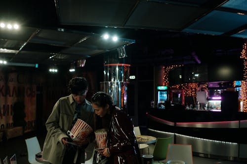 Man and Woman Near a Snack Bar