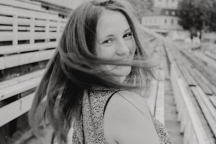 Cheerful Woman Shaking Hair On Street