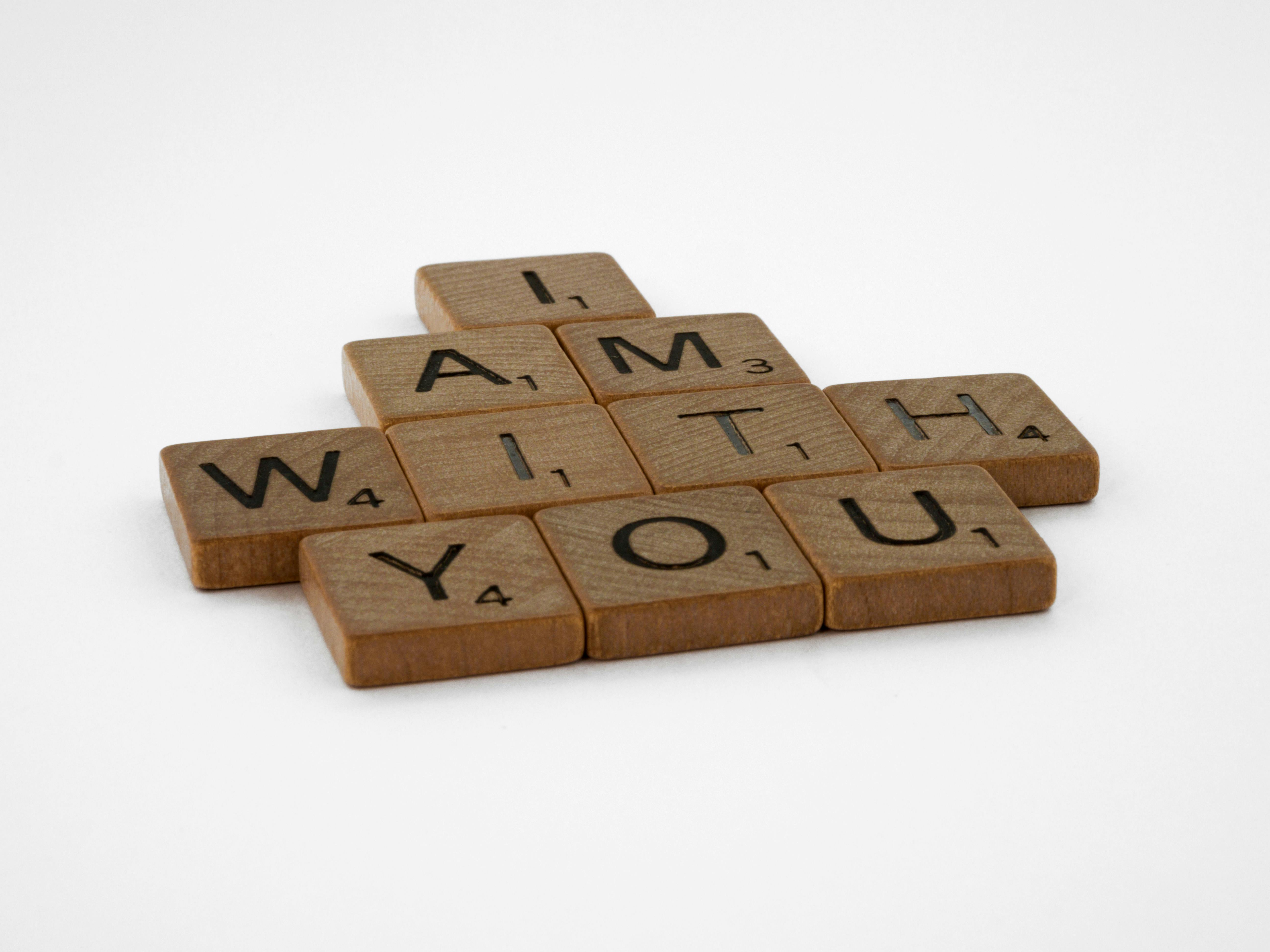 scrabble tiles on a white surface