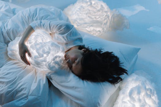 Woman in white hugging glowing cloud pillows in serene, dreamlike setting.