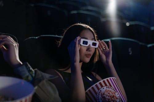 Woman Holding 3D Glasses