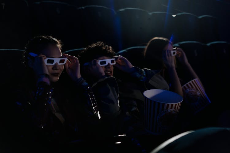 Teenagers In A Cinema Watching A 3D Movie 