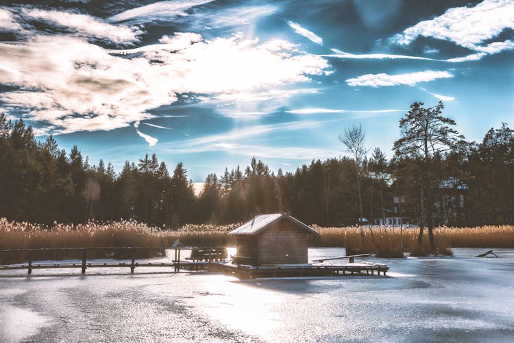 Brown Shack In The Middle Of Frozen Lake