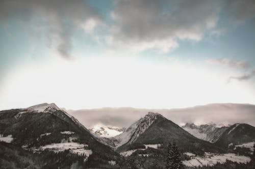Free Gray Mountain at Daytime Under Gray Sky Stock Photo