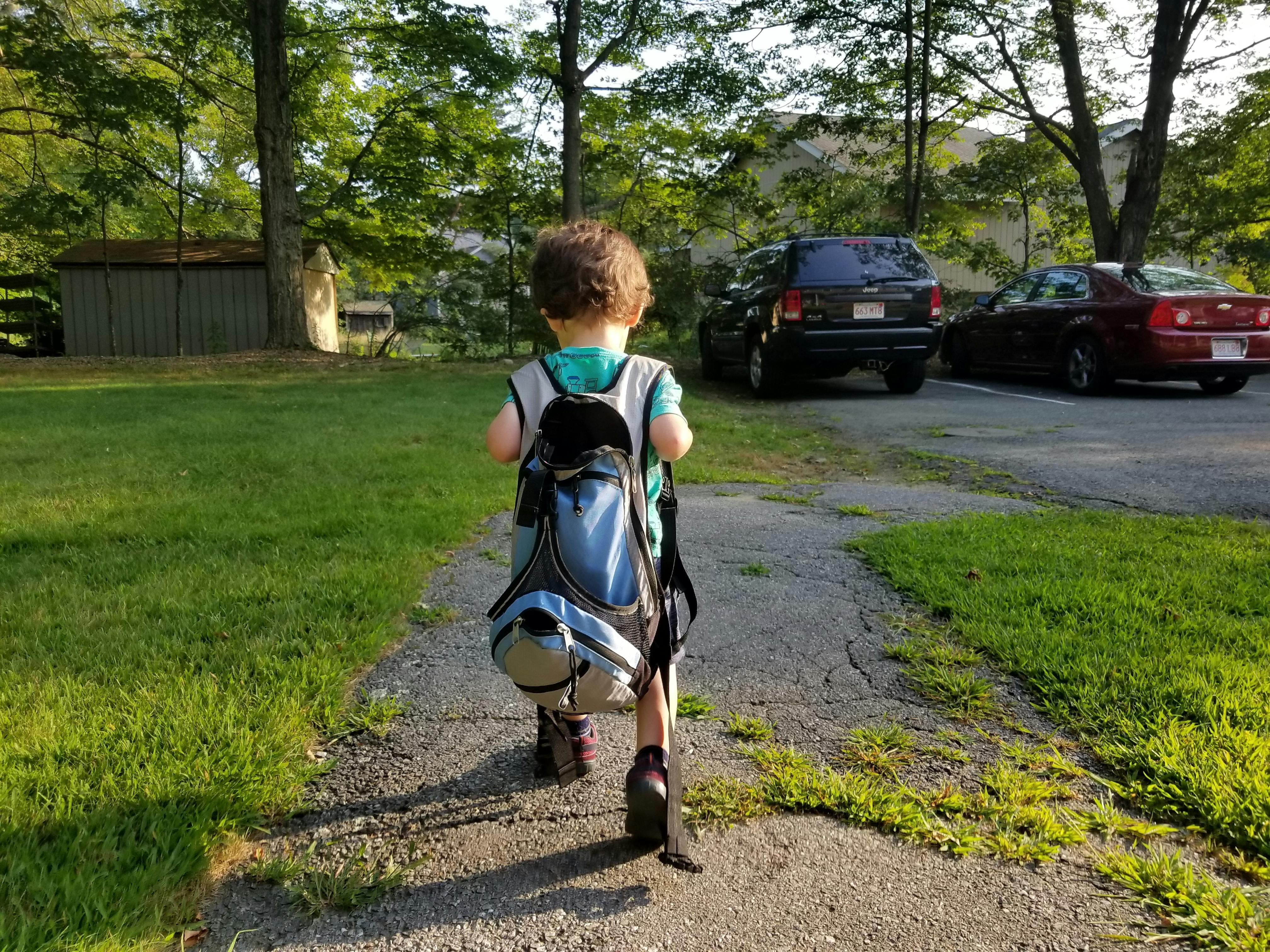 toddler wearing backpack