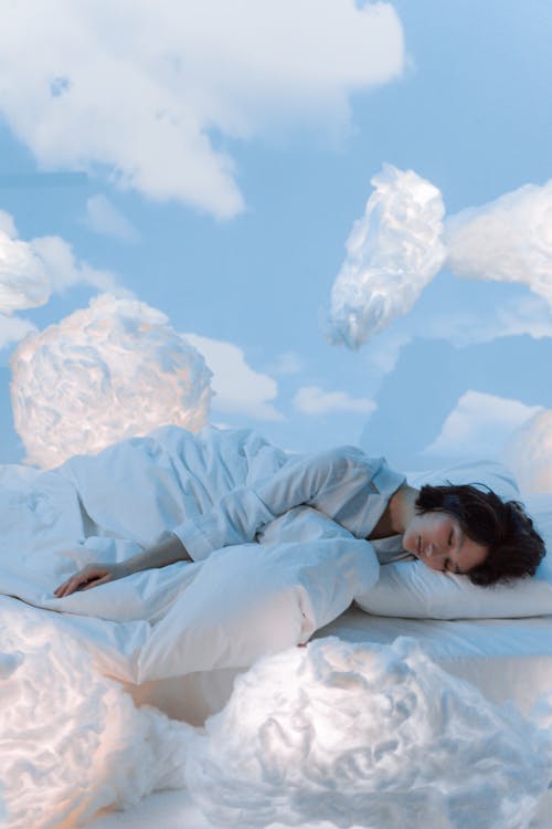 Free Photo of a Woman Dreaming of The Clouds in Her Sleep Stock Photo
