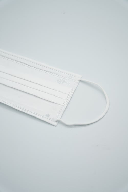 Free A White Face Mask on a White Surface Stock Photo