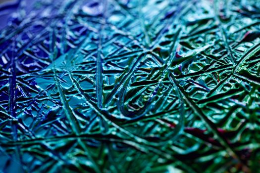Detailed close-up of colorful abstract wax texture with intricate patterns.