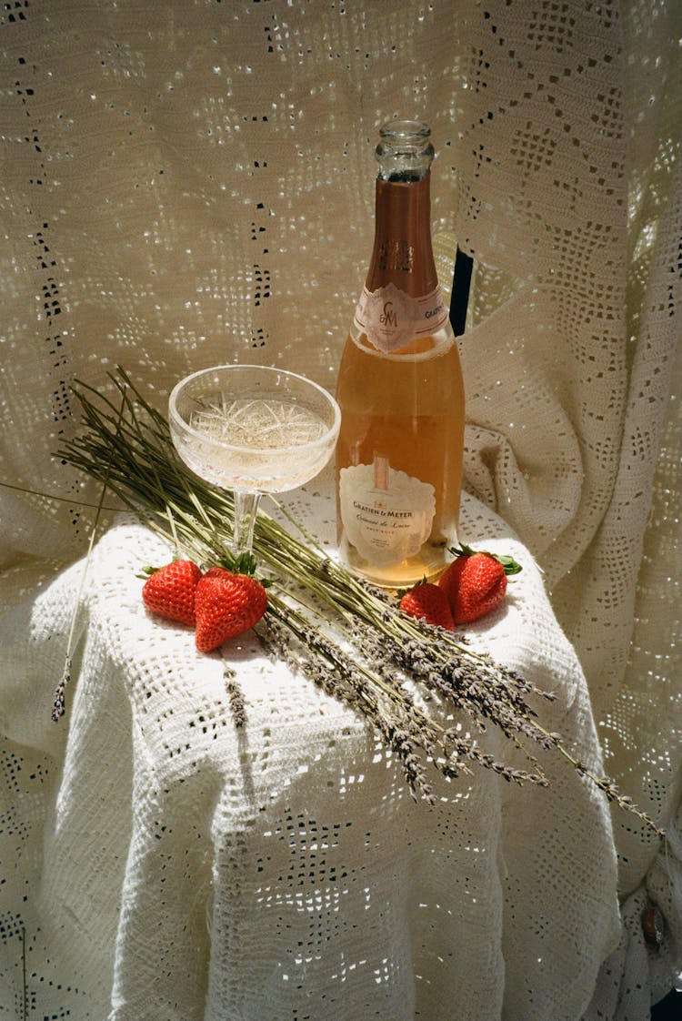 Champagne In A Bottle, Champagne Glass, Flowers And Strawberries 