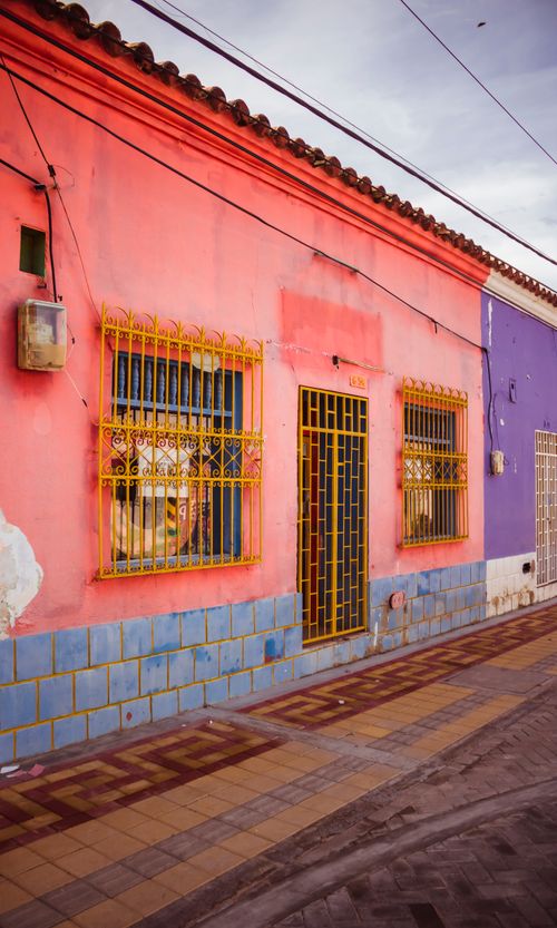 Free Vibrant alleyway with colorful colonial buildings in Valledupar, Colombia. Stock Photo