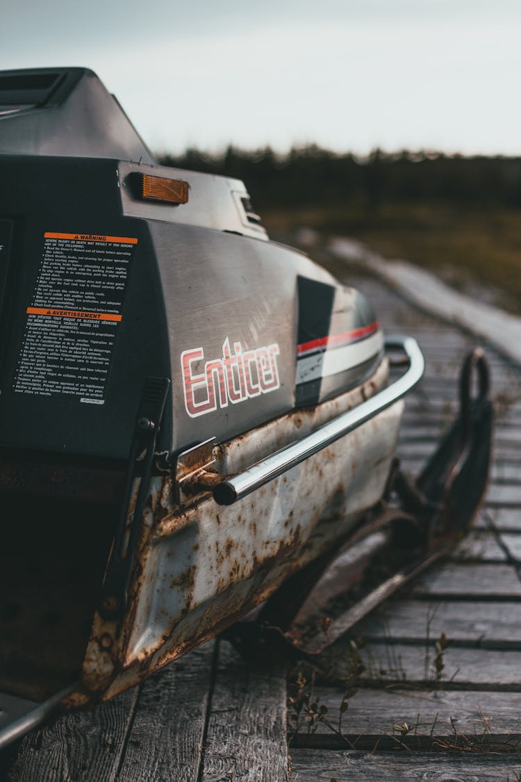 Close-up Of An Old And Rusty Snowmobile 