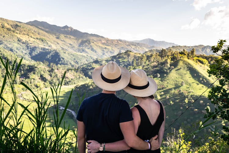 Back View Of A Couple Wearing Fedora Hats