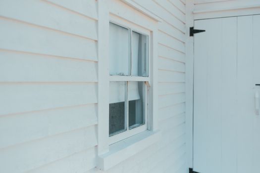 White vinyl siding installed on a home's exterior, offering a clean, durable, and low-maintenance finish for lasting protection.