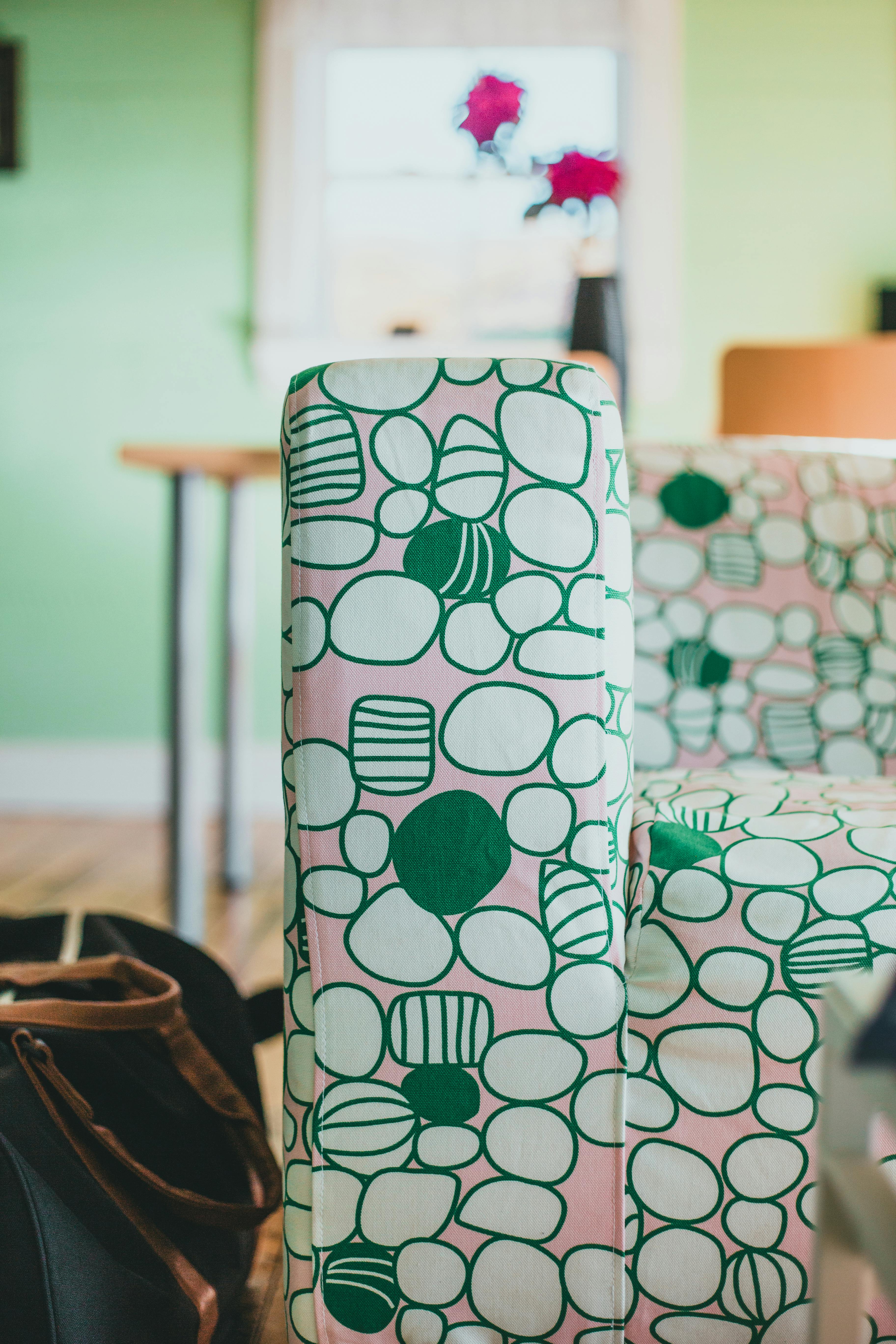 A close-up of vibrant patterned fabrics covering furniture, creating a lively atmosphere indoors.