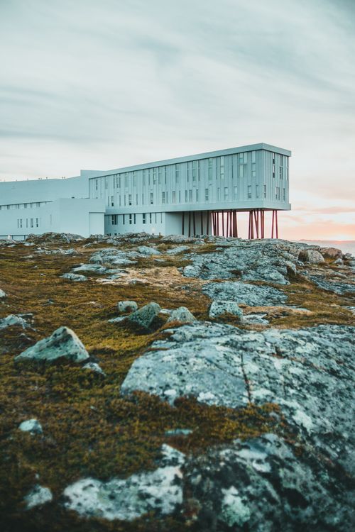Free Modern architecture of Fogo Island Inn against rugged landscape. Stock Photo