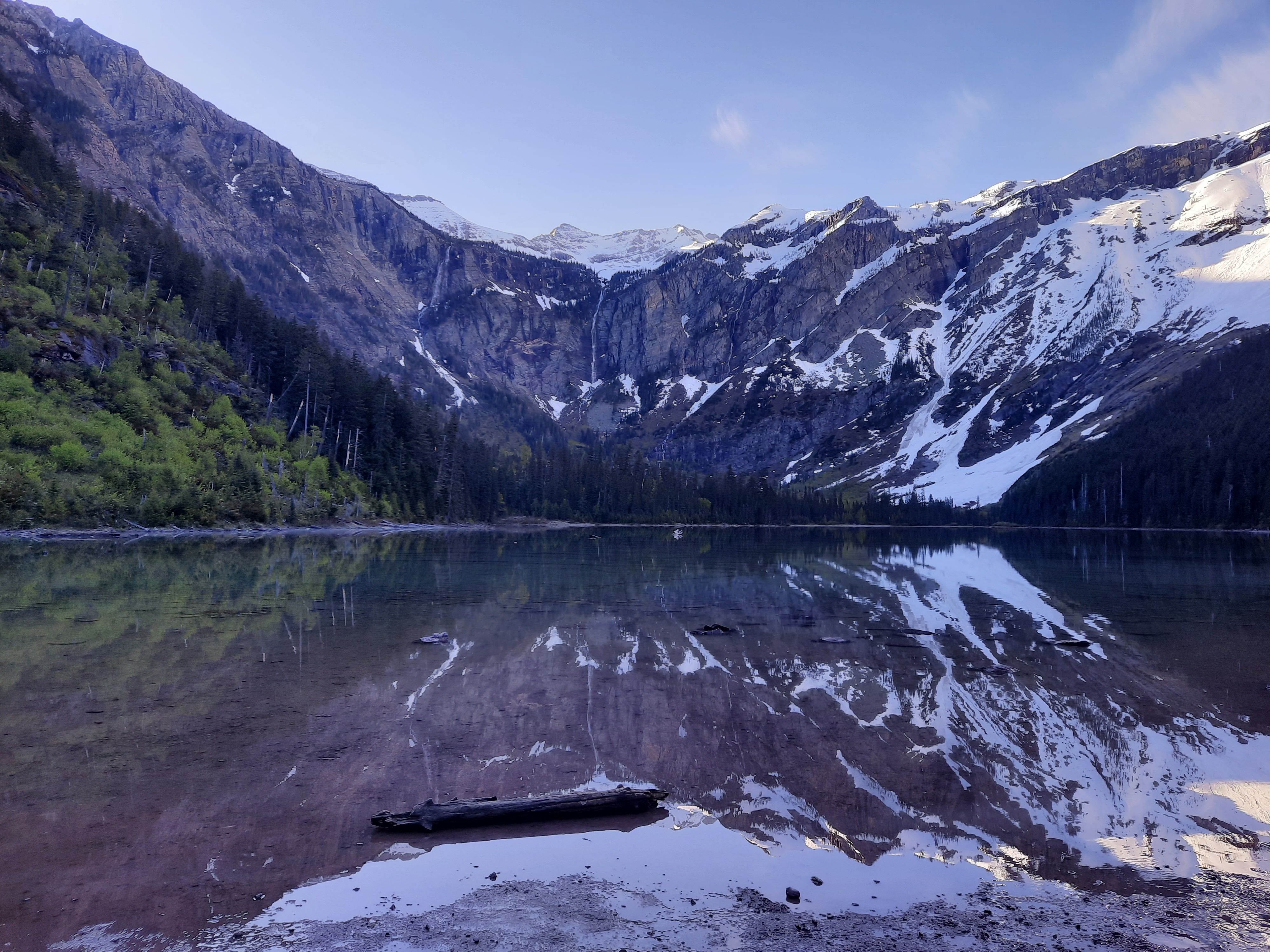 Breathtaking view of a mountain lake reflecting snow-capped peaks in Montana.