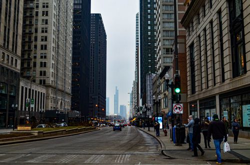 Free Bustling downtown Chicago street scene with skyscrapers and pedestrians. Stock Photo