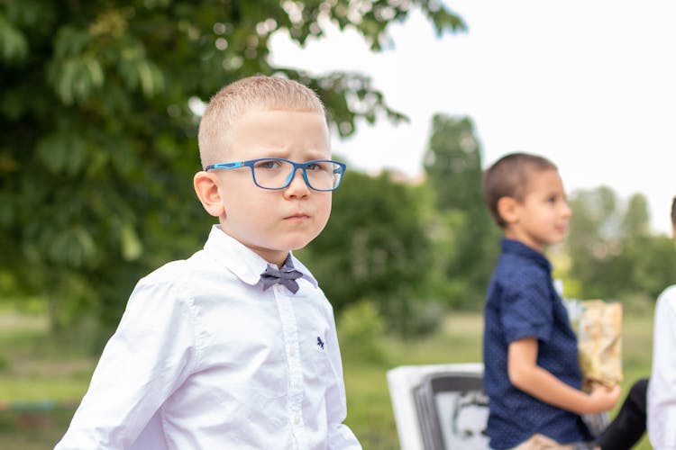 Close-Up Shot Of A Young Boy Wearing Eyeglasses