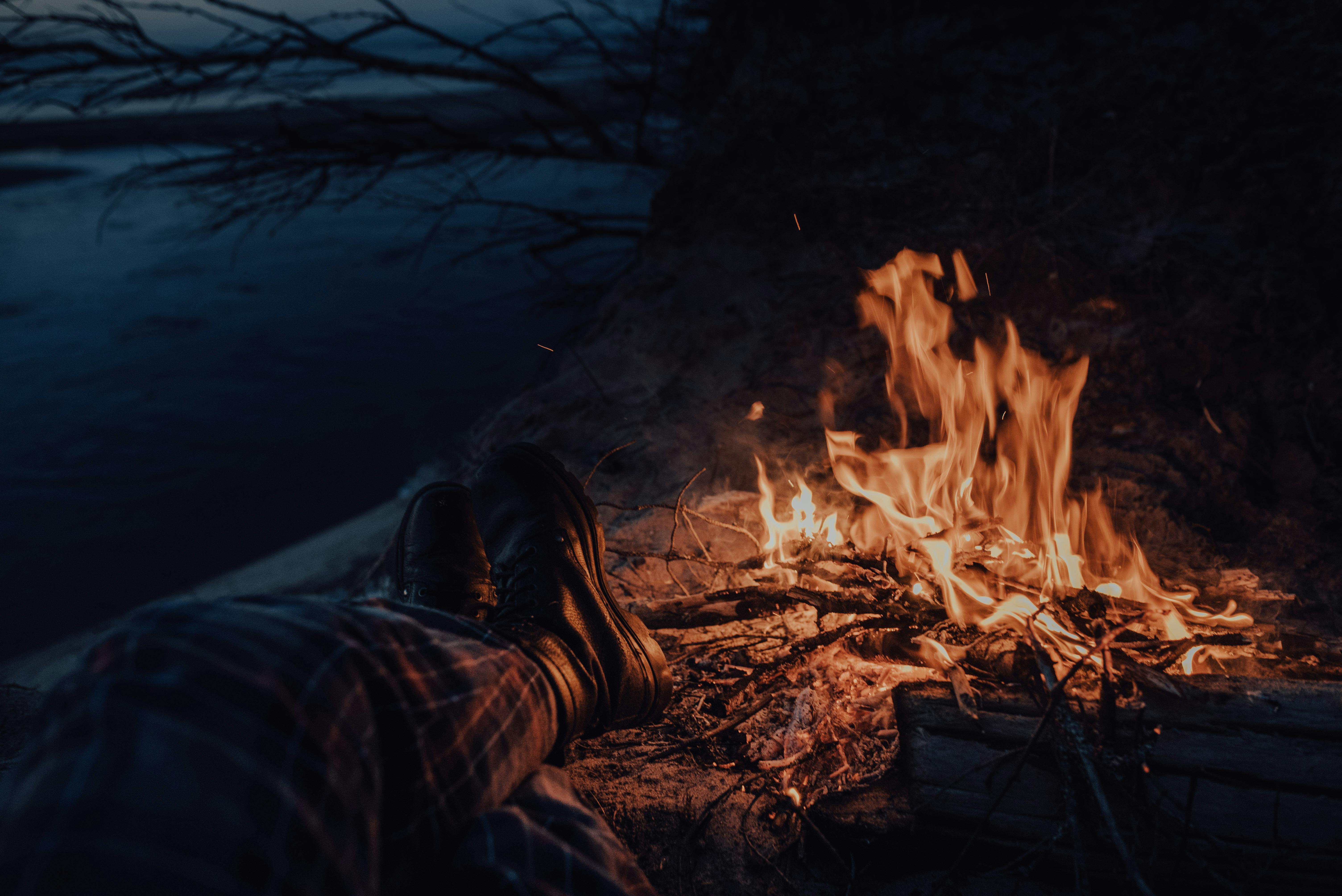 A Person Sitting Beside the Campfire · Free Stock Photo