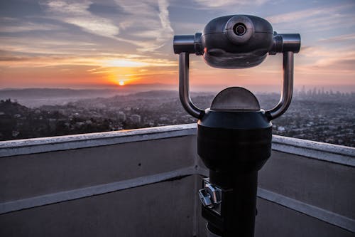 Free Coin-operated Tower Viewer on Rooftop during Sunset Stock Photo