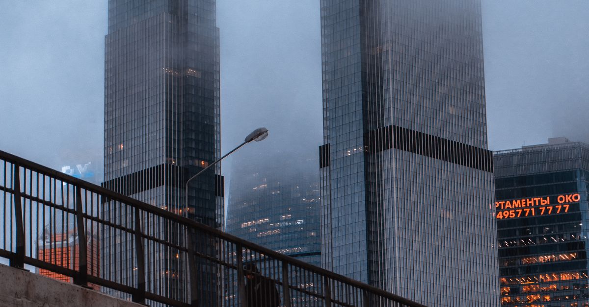 High Rise Building Railing Black Metal Railings Near High Rise Buildings · Free Stock Photo