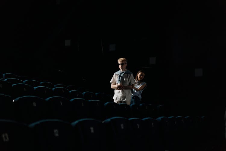 A Woman Guiding A Blind Man