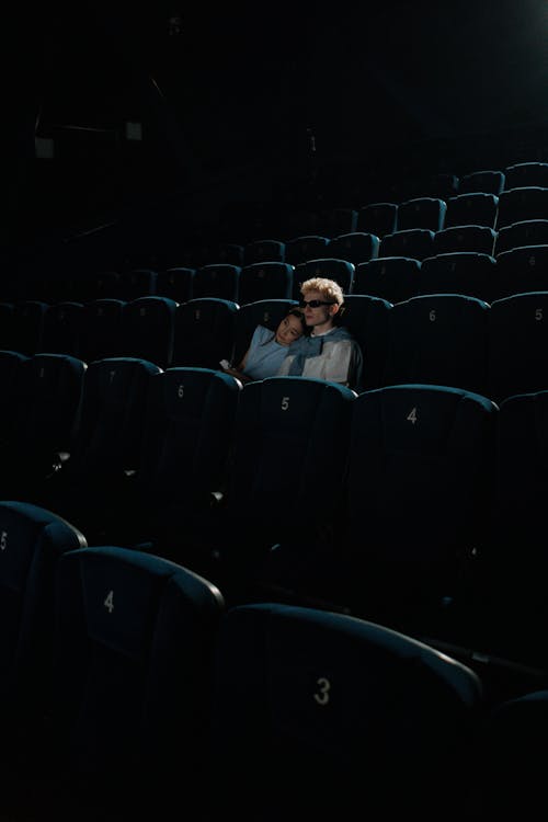 Man and Woman Watching Inside a Cinema