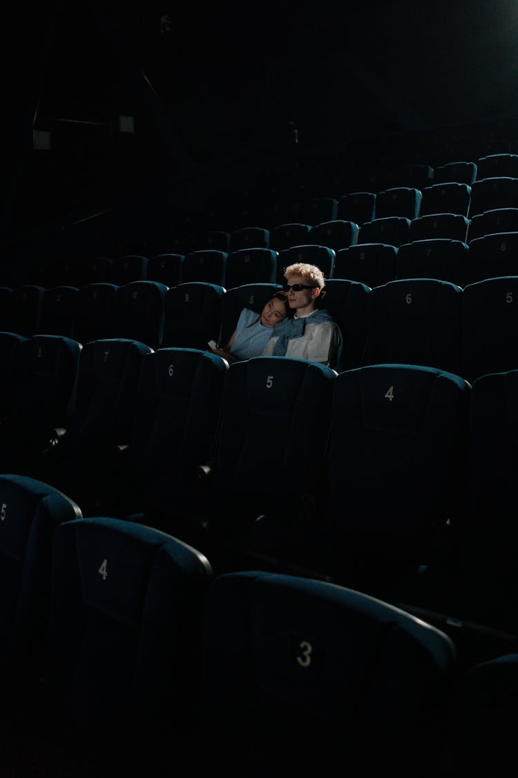 Man And Woman Watching Inside A Cinema