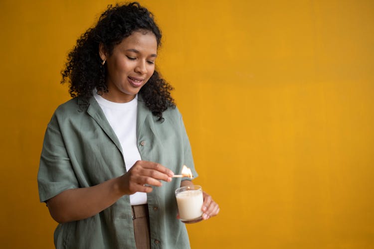 Woman Lighting A Candle