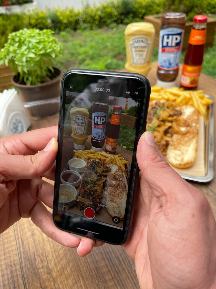 Hands Recording Video Of Food