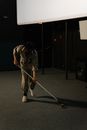 Man Wearing Uniform Cleaning the Floor