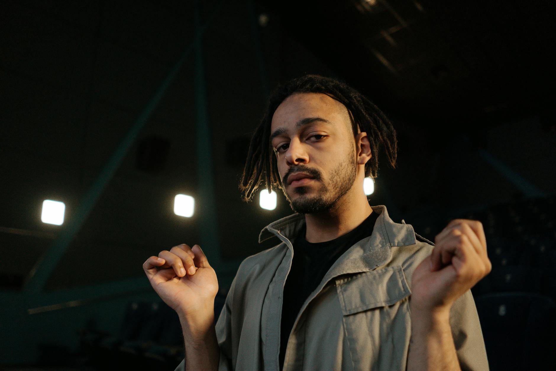 Man working on a laptop with notes and a smartphone nearby, representing professional branding online.